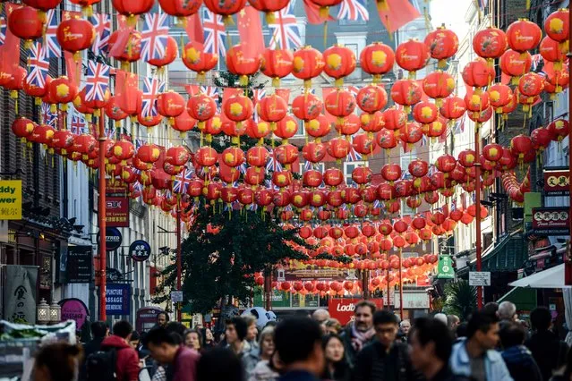 The Union Jack flys alongside the Chinese flag in Chinatown on October 20, 2015 in London, England. (Photo by Chris Ratcliffe/Getty Images)