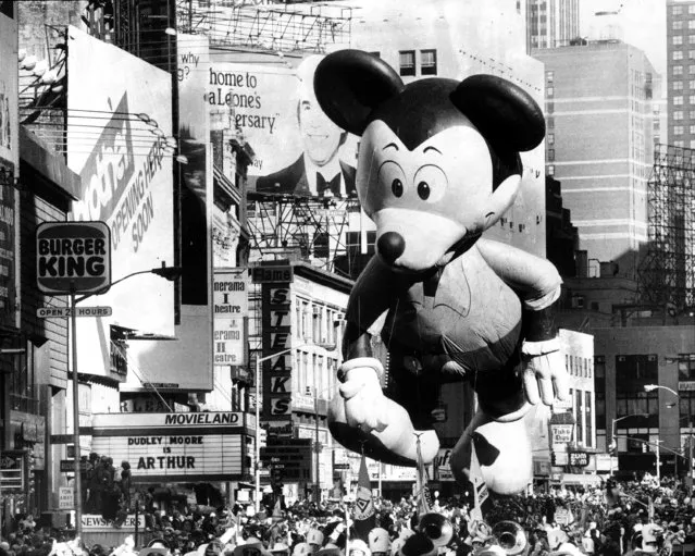 Mickey Mouse takes in Broadway's sights, including a crowd of more than a million, at the 55th annual Macy's Thanksgiving Day Parade, 1981. (Photo by Harry Hamburg/NY Daily News Archive via Getty Images)