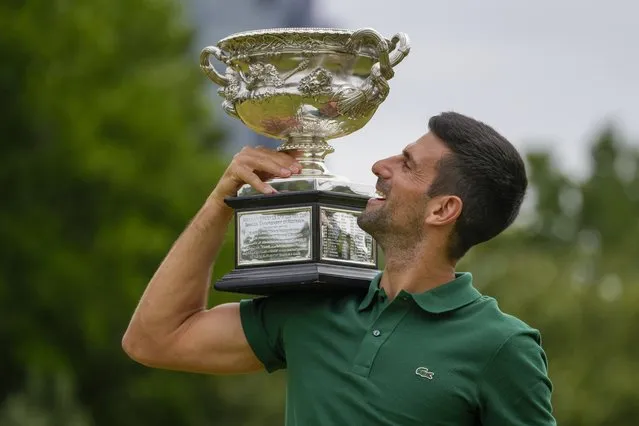 Novak Djokovic of Serbia poses with the Norman Brookes Challenge Cup in the gardens of Government House the morning after defeating Stefanos Tsitsipas of Greece in the men's singles final at the Australian Open tennis championship in Melbourne, Australia, Monday, January 30, 2023. (Photo by Ng Han Guan/AP Photo)