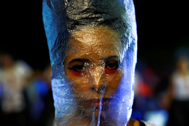 Demonstrators perform in the “Cordao da Mentira” carnival block, against state violence and the military dictatorship during the anniversary of the 1964 coup in Sao Paulo, Brazil, on April 1, 2024. (Photo by Amanda Perobelli/Reuters)