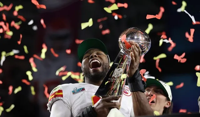 Kansas City Chiefs Carlos Dunlap celebrates with the Vince Lombardi Trophy after defeating the Philadelphia Eagles in Super Bowl LVII between the AFC champion Kansas City Chiefs and the NFC champion Philadelphia Eagles at State Farm Stadium in Glendale, Arizona, 12 February 2023. The annual Super Bowl is the Championship game of the NFL between the AFC Champion and the NFC Champion and has been held every year since January of 1967. (Photo by Caroline Brehman/EPA/EFE)