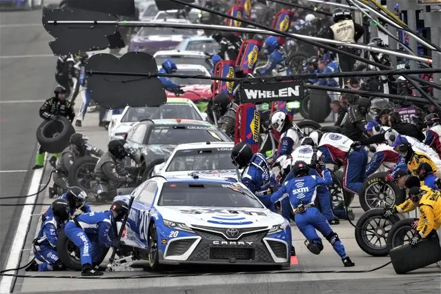 Christopher Bell (20) makes a pit stop during a NASCAR Cup Series auto race at Auto Club Speedway in Fontana, Calif., Sunday, February 26, 2023. (Photo by Jae C. Hong/AP Photo)