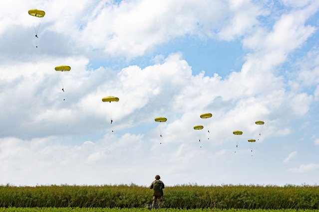 Paratroopers jump into Normandy to pay tribute to the soldiers who parachuted in on D-Day, in Sannerville, Normandy, France, on June 5, 2024. (Photo by UK MOD Crown copyright 2024/Handout via Reuters)