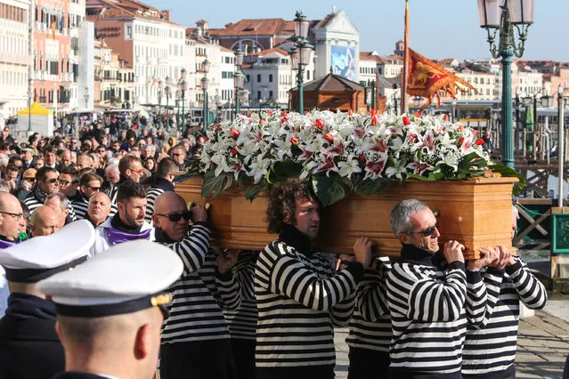 Gondoliers carry the coffin of Valeria Solesin, the only Italian victim of the Paris attacks, at Saint Mark's Square on November 24, 2015 in Venice, Italy.  Valeria Solesin , a student at La Sorbonne, was killed at the Bataclan concert hall. (Photo by Barbara Zanon/Getty Images)