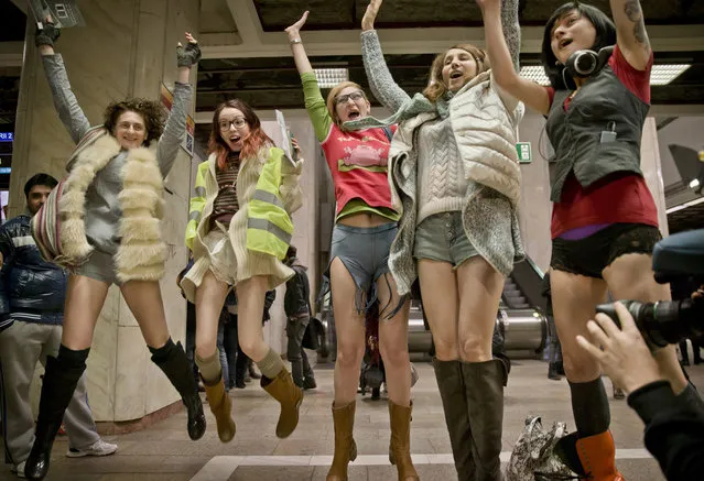 Women jump for a photograph as they take part in the first edition of the No Pants Subway Ride in Bucharest, Romania, Sunday, January 11, 2015. (Photo by Vadim Ghirda/AP Photo)