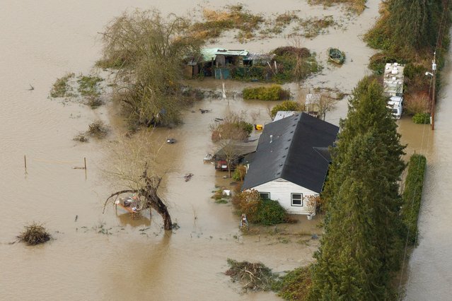 A property flooded by the Snoqualmie River in Fall City, Washington, on December 9, 2025. (Photo by David Ryder/Reuters)