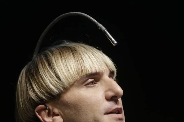 Artist Neil Harbisson, who has an antenna permanently attached to his skull, speaks during the Riga Comm 2014 innovation conference in Riga, Latvia November 14, 2014. (Photo by Ints Kalnins/Reuters)