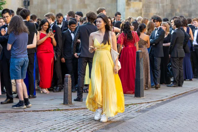 Picture dated June 19th, 2023 shows Cambridge University students on their way to the Trinity May Ball on Monday evening. Hundreds of undergraduates dressed in lavish ball gowns and tuxedos for the lavish end-of-term party. (Photo by Bav Media)