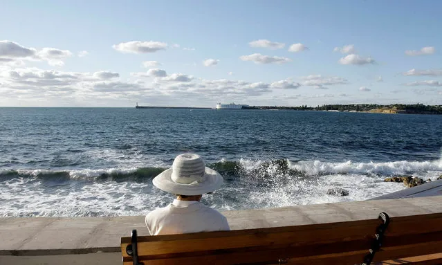 A woman sits at the embankment in the Black Sea city of Sevastopol September 14, 2008. (Photo by Denis Sinyakov/Reuters)