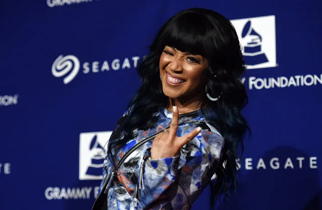 Singer Erica Campbell winks at photographers at the 17th Annual GRAMMY Foundation Legacy Concert at the Wilshire Ebell Theatre on Thursday, February 5, 2015, in Los Angeles. (Photo by Chris Pizzello/Invision/AP Photo)