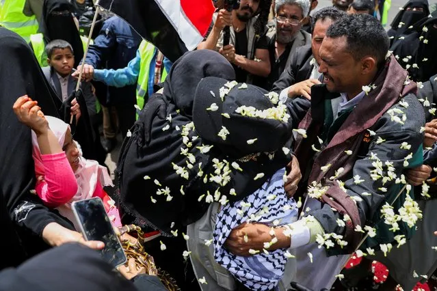 Freed Houthi activist Samira Marish is greeted after arriving on an International Committee of the Red Cross (ICRC)-chartered plane at Sanaa Airport, amid a prisoner swap between two sides in the Yemen conflict, in Sanaa, Yemen on April 16, 2023. (Photo by Khaled Abdullah/Reuters)
