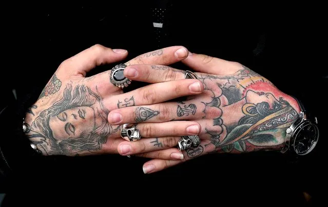 Jimmy Q's displays the tattoos on his hands. (Photo by Oli Scarff/Getty Images)