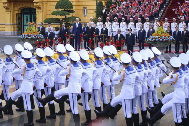 Vietnamese General Secretary of the Communist Party Nguyen Phu Trong, on podium front right, and US President Joe Biden, on podium front left, attend a military welcome ceremony at the Presidential Palace in Hanoi, Vietnam, Sunday, September 10, 2023. Biden is on an official two-day visit in Vietnam. Photo by (Luong Thai Linh/Pool Photo via AP Photo)