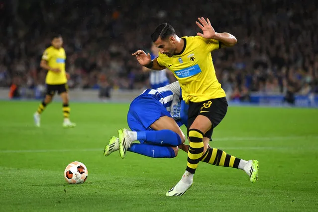 Ehsan Hajsafi of AEK Athens clashes with Joao Pedro of Brighton & Hove Albion during the UEFA Europa League 2023/24 group stage match between Brighton & Hove Albion and AEK Athens FC at American Express Community Stadium on September 21, 2023 in Brighton, England. (Photo by Mike Hewitt/Getty Images)