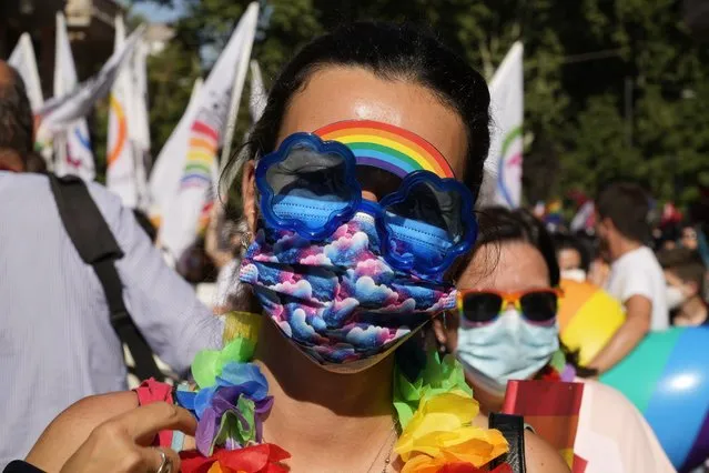 People take part in the annual Pride march, in Rome, Saturday, June 26, 2021. This year's march comes amid widespread concern in Europe about legislation in Hungary that will ban showing content about LGBT issues to children and a controversial Vatican communication to Italy, criticizing a law that would extend additional protections from discrimination to the LGBT community. (Photo by Gregorio Borgia/AP Photo)