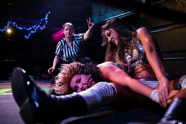 Wrestlers perform during an all-female wrestling event on International Women's Day at the Resistance Gallery in Bethnal Green on March 8, 2019 in London, England. (Photo by Jack Taylor/Getty Images)