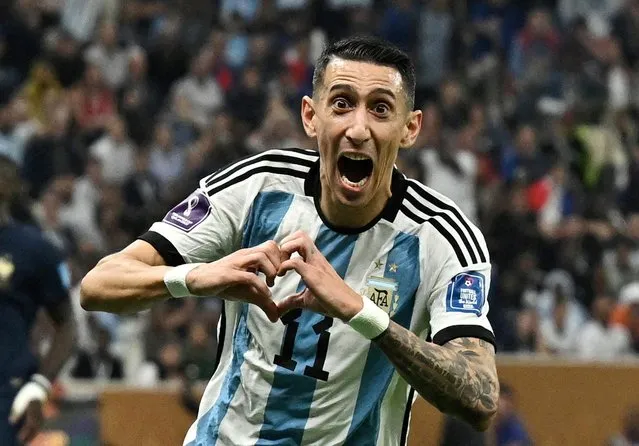 Argentina's midfielder #11 Angel Di Maria celebrates scoring his team's second goal during the Qatar 2022 World Cup final football match between Argentina and France at Lusail Stadium in Lusail, north of Doha on December 18, 2022. (Photo by Dylan Martinez/Reuters)