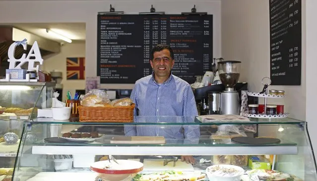 Ayoud Seddiki, 51, poses for a photograph at his workplace, Venezia Coffee, in the London constituency of Brent Central, Britain, April 3, 2015. Seddiki, who was born in Morocco, said: “The politicians don't deliver everything they promise. They just want to get in power. I used to always vote Labour but I lost interest in politics when they went to war in Iraq for the oil”. (Photo by Eddie Keogh/Reuters)