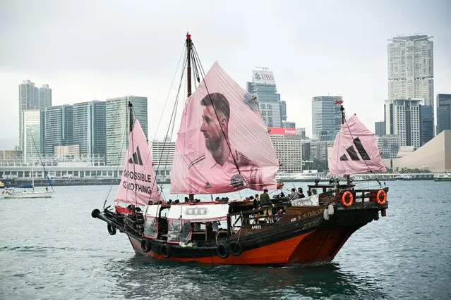A junk with the face of Inter Miami CF Argentine forward Lionel Messi on its sail sails across Hong Kong's Victoria Harbour on February 2, 2024, ahead of the friendly football match between Inter Miami CF and Hong Kong Team on February 4, 2024. (Photo by Peter Parks/AFP Photo)