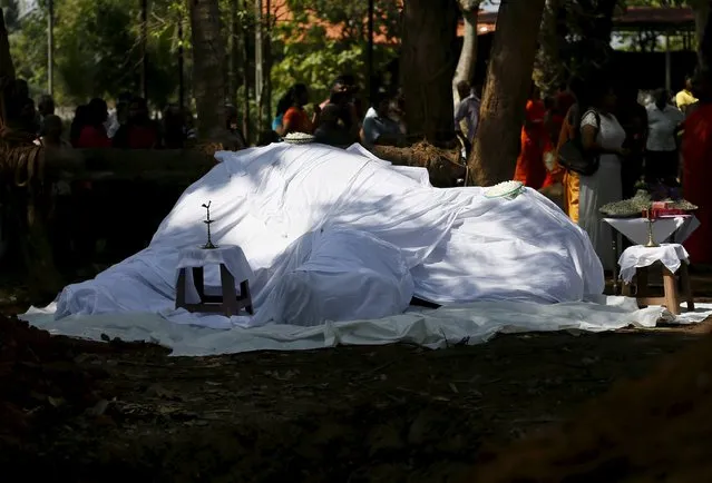 A covered dead body of elephant Hemantha is seen during a religious ceremony at a Buddhist temple in Colombo March 15, 2016. (Photo by Dinuka Liyanawatte/Reuters)