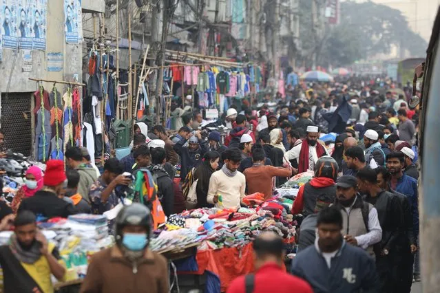 People are shopping for winter wear on a cold winter day in Dhaka, Bangladesh, on January 17, 2024. Bangladesh has recorded its lowest temperature at 8.5 degrees Celsius in Dinajpur. (Photo by Habibur Rahman/ABACA Press/Rex Features/Shutterstock)