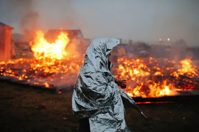 Campers set structures on fire in preparation of the Army Corp's 2pm deadline to leave the Oceti Sakowin protest camp on February 22, 2017 in Cannon Ball, North Dakota. Activists and protesters have occupied the Standing Rock Sioux reservation for months in opposotion to the completion of the Dakota Access Pipeline. (Photo by Stephen Yang/Getty Images)