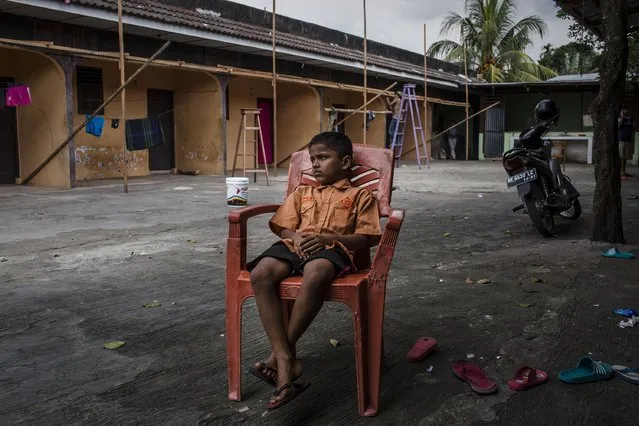 A Rohingya refugee kid sits in front of their refugee camp on February 11, 2017 in Medan, North Sumatra, Indonesia. (Photo by Ulet Ifansasti/Getty Images)
