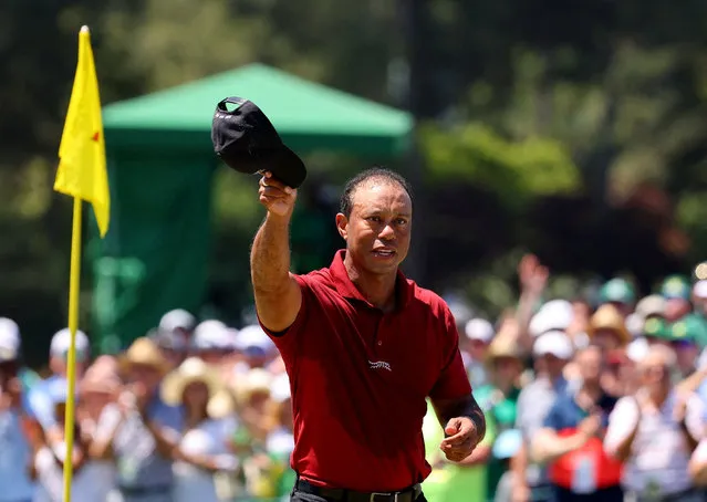 Tiger Woods of the U.S. acknowledges the crowd on the green on the 18th hole after completing his final round in Augusta on April 14, 2024. (Photo by Mike Blake/Reuters)