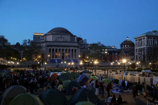Dusk falls at the protest encampment in support of Palestinians at Columbia University, during the ongoing conflict between Israel and the Palestinian Islamist group Hamas, in New York City on April 22, 2024. (Photo by Caitlin Ochs/Reuters)