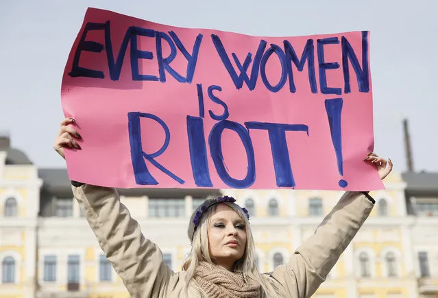 A woman holds a placard during a rally for gender equality and against violence towards women on International Women's Day in Kiev, Ukraine, March 8, 2017. (Photo by Valentyn Ogirenko/Reuters)