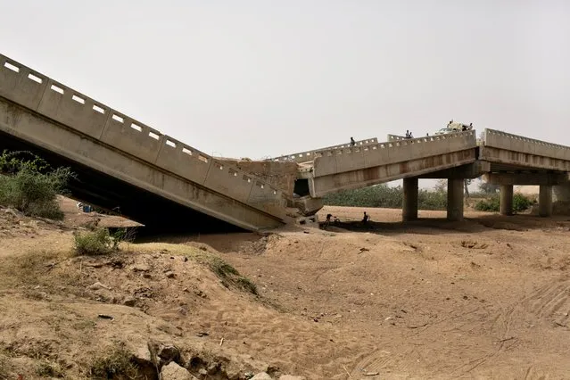 The Kudzum Bridge on the road to the village of Michika in northern Nigeria's Adamawa State was damaged, according to the Premium Times based in Nigeria, by Boko Haram while they occupied the territory to prevent the Nigerian military from advancing. Now liberated from Boko Haram, the bridge remains damaged, making it difficult for large shipment trucks to carry goods to villages in northern Nigeria, February 20, 2016. (Photo by Danielle Villasana)