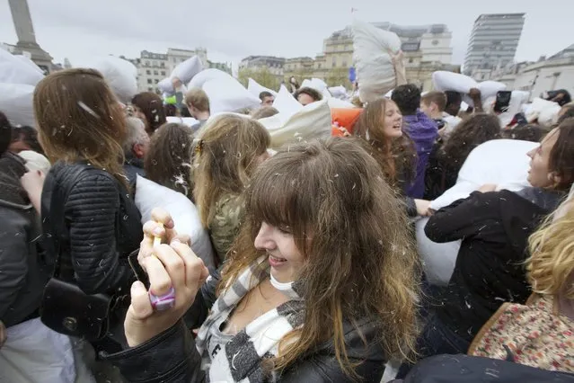A mass pillow fight in Trafalgar Square in central London on April 5, 2014 on International Pillow Fight Day. (Photo by Jane Scanlan)