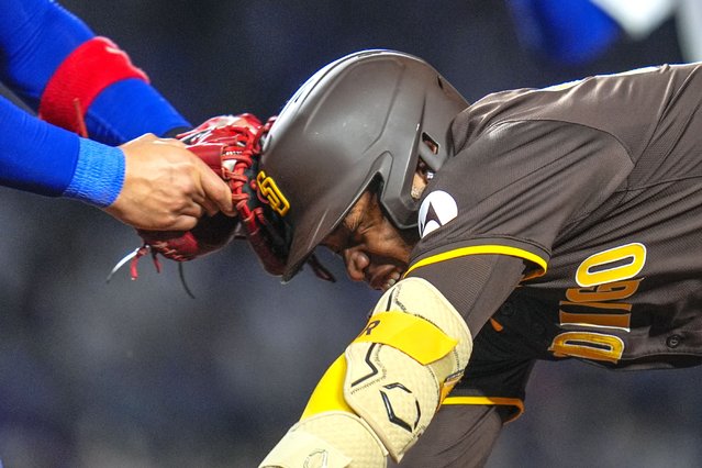 San Diego Padres' José Azocar gets caught between first and second bases and is tagged out at first by Chicago Cubs catcher Miguel Amaya during the seventh inning of a baseball game Tuesday, May 7, 2024, in Chicago. (Photo by Erin Hooley/AP Photo)