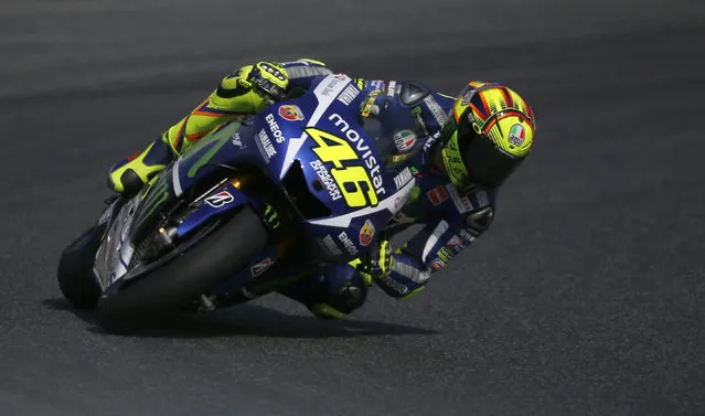 Yamaha's Moto GP rider Valentino Rossi, from Italy, steers his bike during the third free practice for the motorcycle GP in Montmelo, Spain, Saturday, June 13, 2015. The Catalunya Grand Prix will take place on Sunday in Montmelo. (AP Photo/Manu Fernandez)