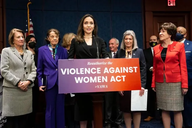 Actress and activist Angelina Jolie, center, joins, from left, Sen. Shelley Moore Capito, R-W.Va., Sen. Dianne Feinstein, D-Calif., Sen. Joni Ernst, R-Iowa, and Sen. Susan Collins, R-Maine, at a news conference to announce a bipartisan update to the Violence Against Women Act, at the Capitol in Washington, Wednesday, February 9, 2022. (Photo by J. Scott Applewhite/AP Photo)