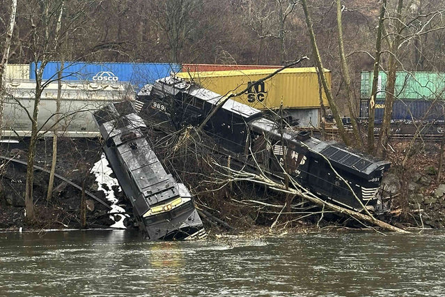 This photo provided by Nancy Run Fire Company shows a train derailment along a riverbank in Saucon Township, Pa., on Saturday, March 2, 2024. Authorities said it was unclear how many cars were involved but no injuries or hazardous materials were reported. (Photo by Nancy Run Fire Company via AP Photo)