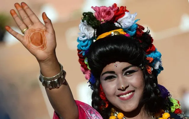 A Berber Moroccan woman, wearing traditional outfits, parades during the “Miss Rose” beauty contest as part of the yearly Rose Festival on May 13, 2016 in the town of Kelaat Mgouna, at the foot of the High Atlas Mountains in Morocco. (Photo by Fadel Senna/AFP Photo)