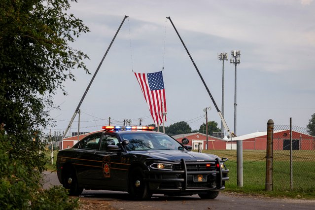 A state trooper's car blocks an entrance to the event grounds where the rally was held, during the law enforcement investigation into gunfire at a campaign rally of Republican presidential candidate and former President Donald Trump in Butler, Pennsylvania on July 15, 2024. (Photo by Brendan McDermid/Reuters)