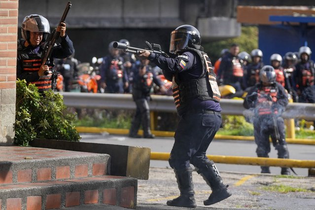 Police aim at protesters demonstrating against the official election results after electoral authorities certified President Nicolas Maduro's reelection in Caracas, Venezuela, Monday, July 29, 2024, the day after the vote. (Photo by Fernando Vergara/AP Photo)