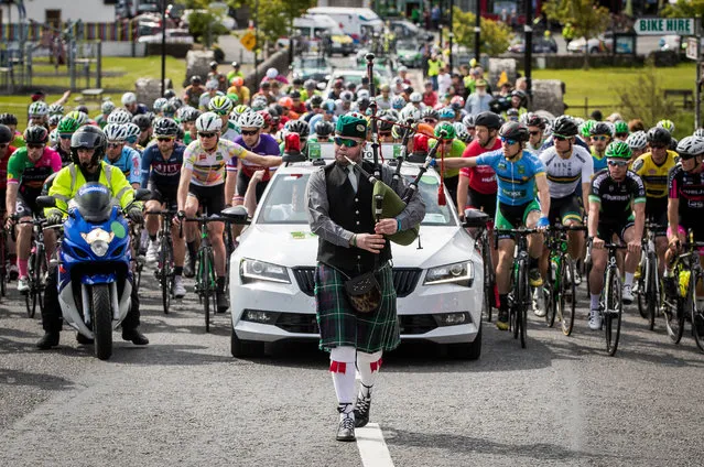 A bagpiper leads the cyclists to the start of the third stage of the An Post Ras in Newport, Ireland on May 23, 2017. (Photo by Byrne/INPHO/Rex Features/Shutterstock)
