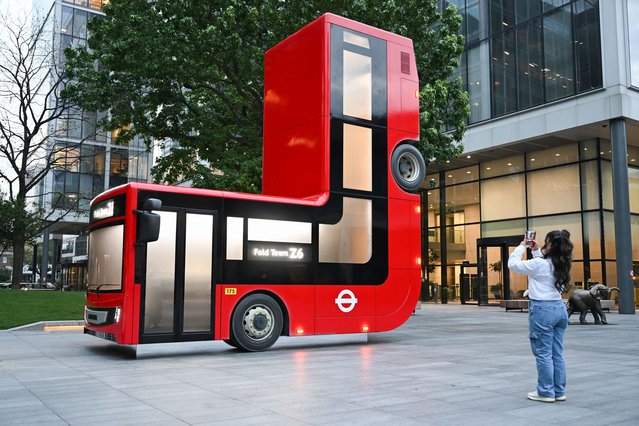 An art installation of a folded London bus by Caspar Philips is unveiled at Bishops Square, London, commissioned by Samsung. The bus is folded at 90-degrees and forms part of a wider art project, Fold Town, by Samsung to mark the release of the Samsung Galaxy Z Flip6 and Z Fold6, now with Galaxy AI technology on July 24, 2024 in London, England. (Photo by Jeff Spicer/Getty Images for Samsung)