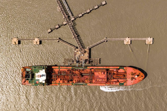 This aerial view shows the Liberia-flagged liquefied petroleum gas (LPG) tanker Navigator Gemini at the pier of the liquid gas wharf in Iraq's southern port of Umm Qasr on September 4, 2024. (Photo by Hussein Faleh/AFP Photo)