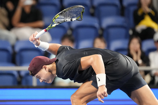 Holger Rune of Denmark smashes his racket in frustration during his men's singles semifinal match against Arthur Fils of France at the Japan Open tennis tournament on Monday, September 30, 2024, at Ariake Colosseum, in Tokyo, Japan. (Photo by Eugene Hoshiko/AP Photo)