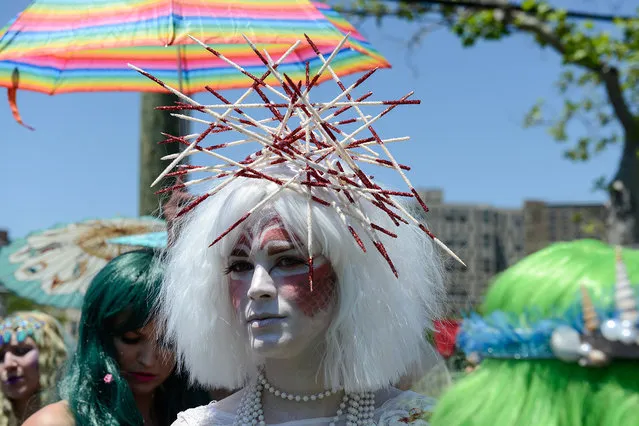 People participate in Coney Island's annual Mermaid Parade on June 18, 2016 in the Brooklyn borough of New York City. The 34th annual parade celebrates mythology, artistic spirit and seaside culture. (Photo by Stephanie Keith/Getty Images)