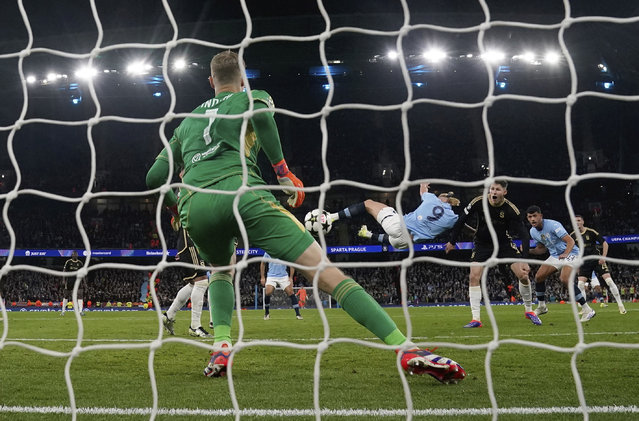 Manchester City's Erling Haaland scores his side's second goal during the Champions League opening phase soccer match between Manchester City and Sparta Praha at the Etihad Stadium in Manchester, England, Wednesday, October 23 , 2024. (Photo by Nick Potts/PA Wire via AP Photo)