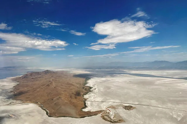 Dry land surrounds Antelope Island where there used to be water in the Great Salt Lake, in Salt Lake City, Utah, U.S., July 13, 2022. (Photo by Brian Snyder/Reuters)
