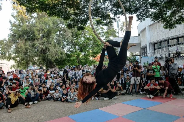 Italian trainer make a show of acrobat during Cultural Exchange Festival between Italy and gaza, at park in Gaza City, on Tuesday, June 14, 2022. A group of Italian trainers trained a young palestinians youths for weeks for circus show, dance and acrobat. (Photo by Sameh Rahmi/NurPhoto via Getty Images)