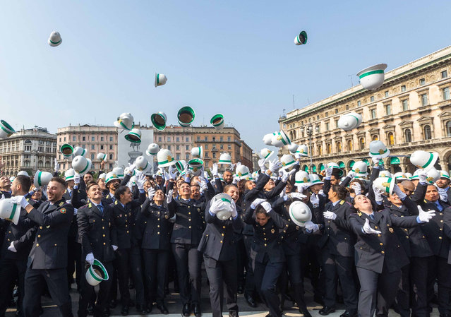 Hats are thrown into the air during celebrations for the 163rd anniversary of the founding of the city’s police force in Milan, Italy on October 4, 2023. (Photo by Stefano Porta/LaPresse/Rex Features/Shutterstock)