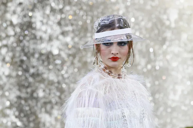 A model wears a creation for the Chanel Spring/Summer 2018 ready-to-wear fashion collection presented in Paris, Tuesday, October 3, 2017. (Photo by Francois Mori/AP Photo)