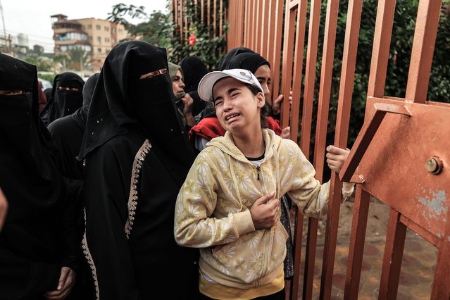 Relatives of Palestinians who lost their lives bid farewell in front of the morgue of Nasser Medical Hospital in the city of Khan Yunis, southern Gaza Strip on November 14, 2023. (Photo by Loay Ayyoub/The Washington Post)
